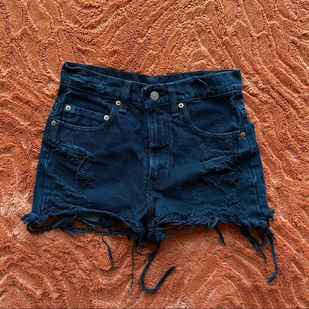 LEVI’S black distressed jean shorts